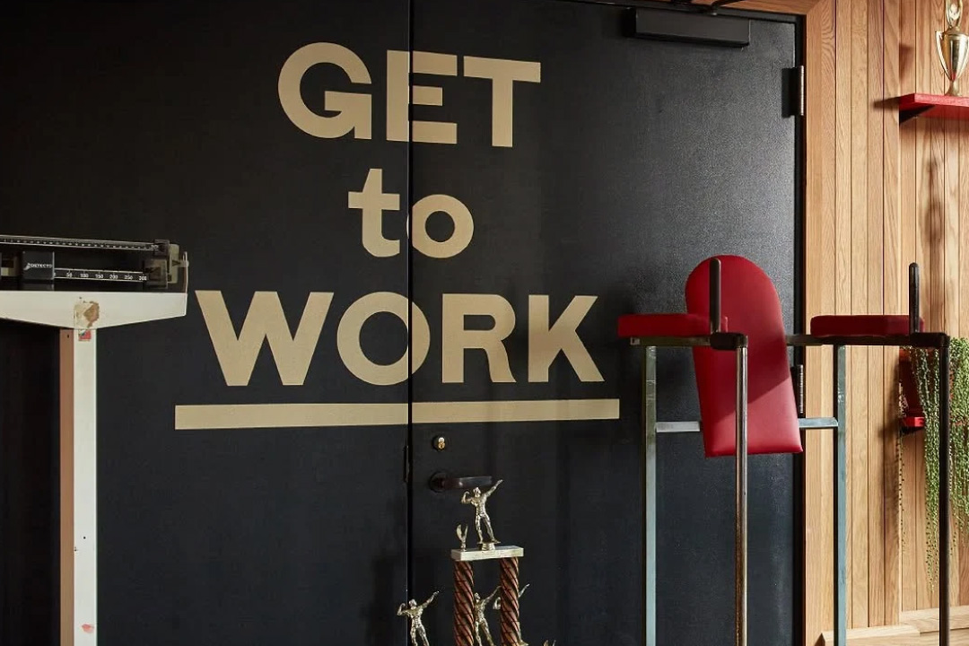 a photo of a gym with equipment that includes treadmills. A sign that reads, 'pump up, dont shoot up'